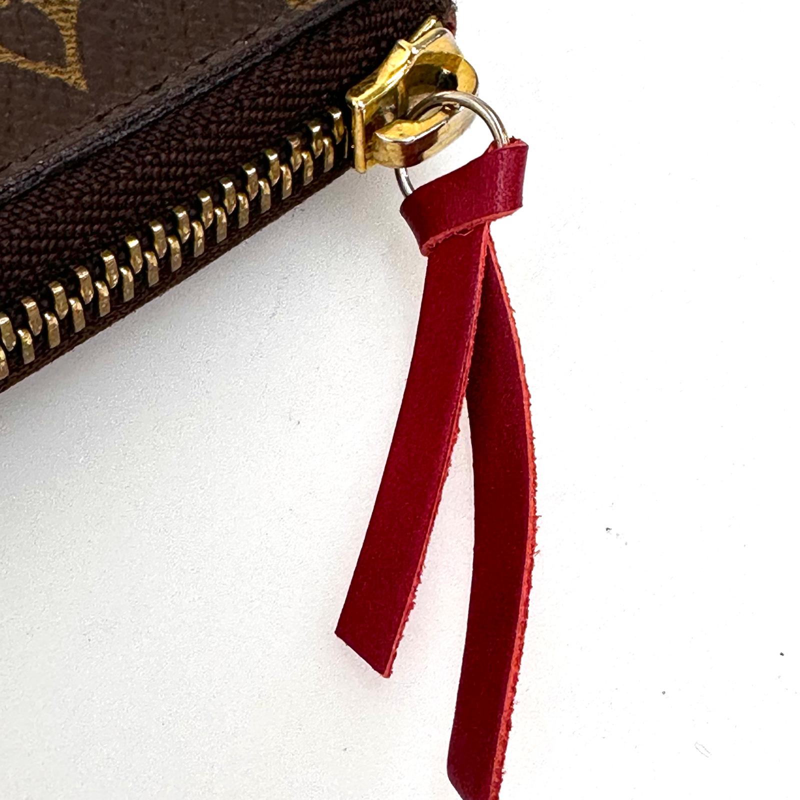 Louis Vuitton Portafoglio Zippé Clémence in Tela Monogram e arancio