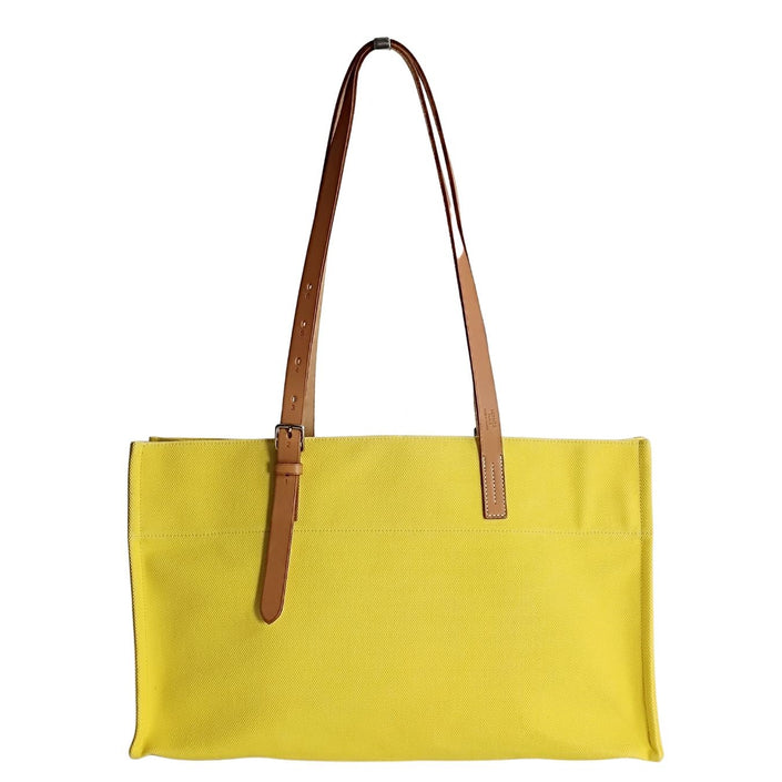 Hermès Étrivière shoulder bag in yellow canvas