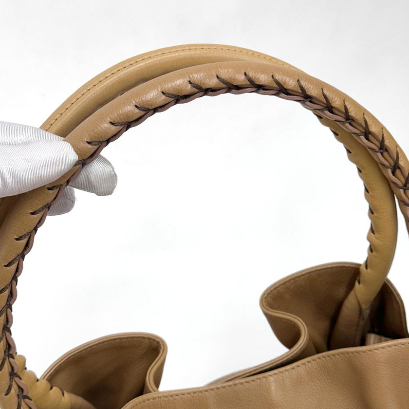Bvlgari Borsa Twist in pelle martellata beige a due vie