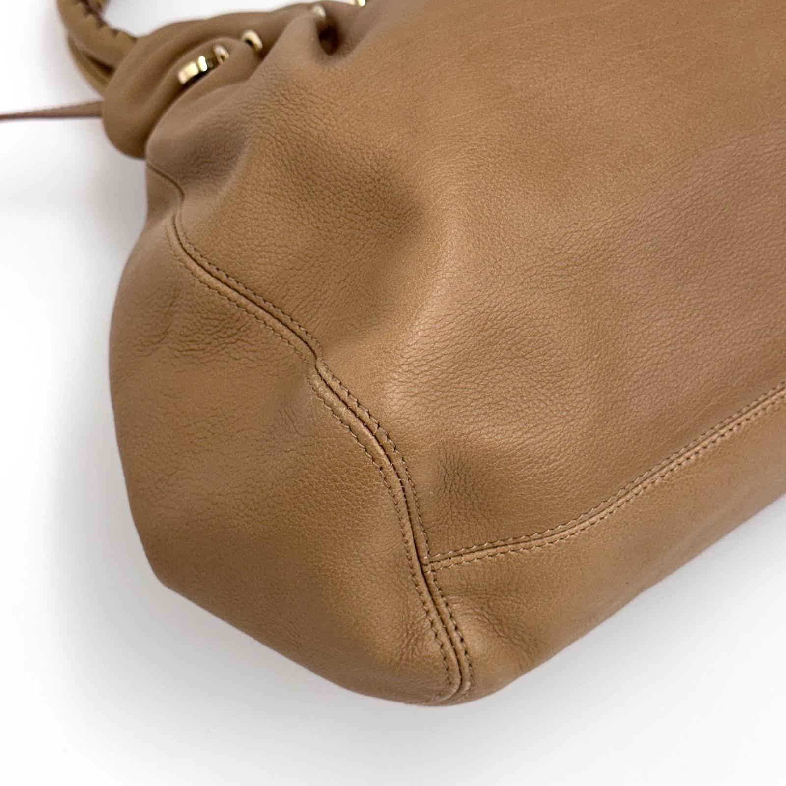 Bvlgari Borsa Twist in pelle martellata beige a due vie