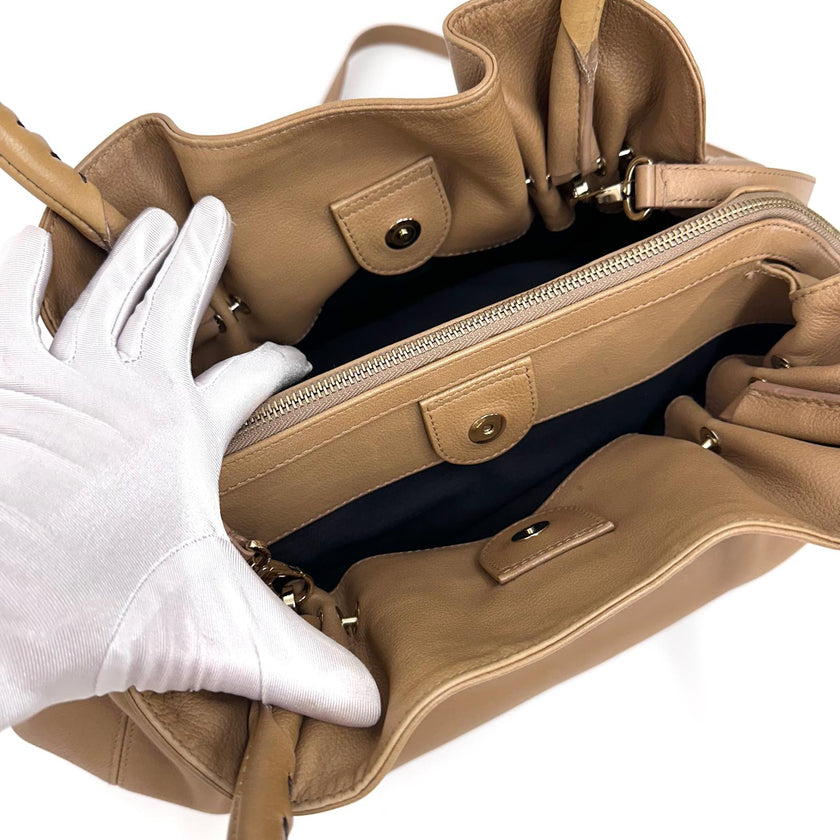 Bvlgari Borsa Twist in pelle martellata beige a due vie