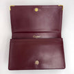 Cartier Borsa clutch in pelle bordeaux con logo centrale