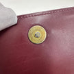 Cartier Borsa clutch in pelle bordeaux con logo centrale