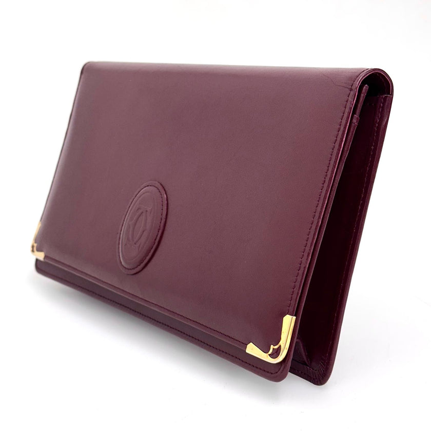 Cartier Borsa clutch in pelle bordeaux con logo centrale