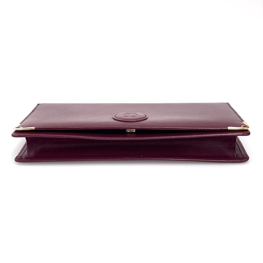 Cartier Borsa clutch in pelle bordeaux con logo centrale