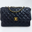 Chanel Borsa Classic Flap 25 in Pelle Nera con Finiture in Oro 24k