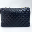 Chanel Borsa Classic Flap 25 in Pelle Nera con Finiture in Oro 24k