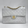 Chanel Classic Flap  Maxi in Pelle Bianca con Finiture Oro