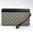 Gucci Clutch a mano GG Supreme con laccetto in pelle testa di moro