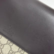 Gucci Clutch a mano GG Supreme con laccetto in pelle testa di moro