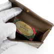 Gucci Portafoglio in tela GG Supreme e pelle marrone con chiusura Web