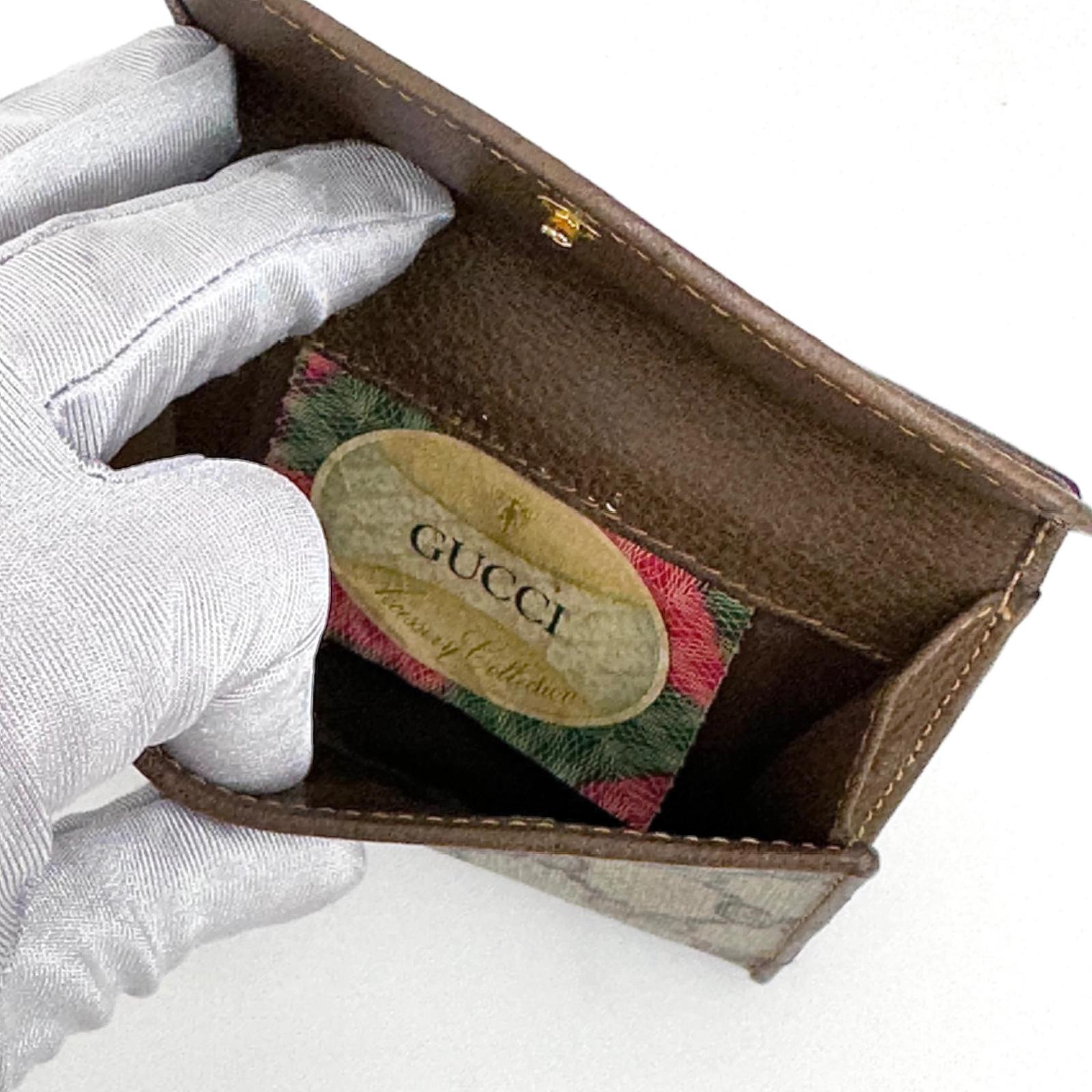 Gucci Portafoglio in tela GG Supreme e pelle marrone con chiusura Web