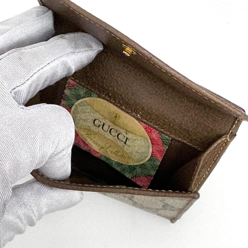 Gucci Portafoglio in tela GG Supreme e pelle marrone con chiusura Web