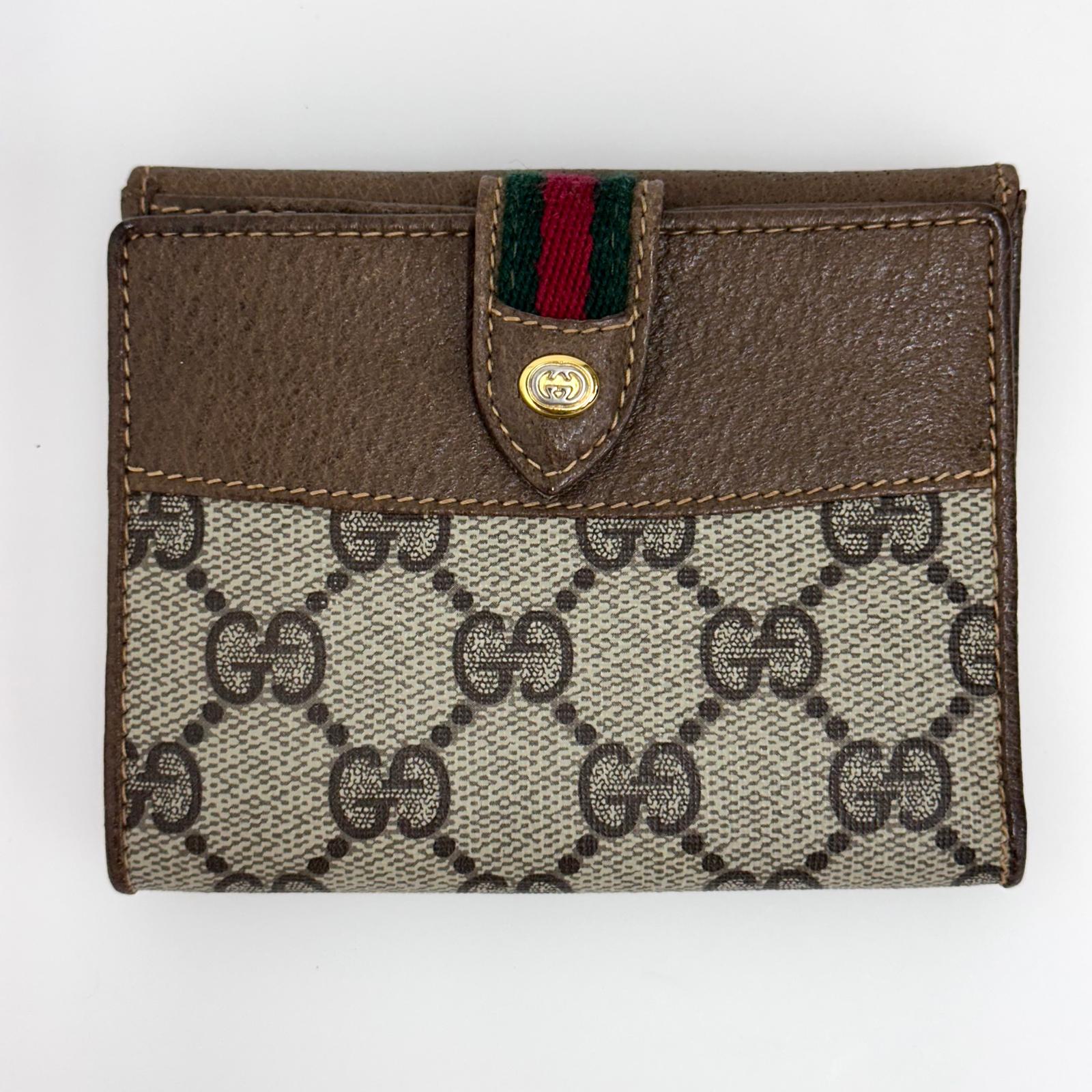 Gucci Portafoglio in tela GG Supreme e pelle marrone con chiusura Web