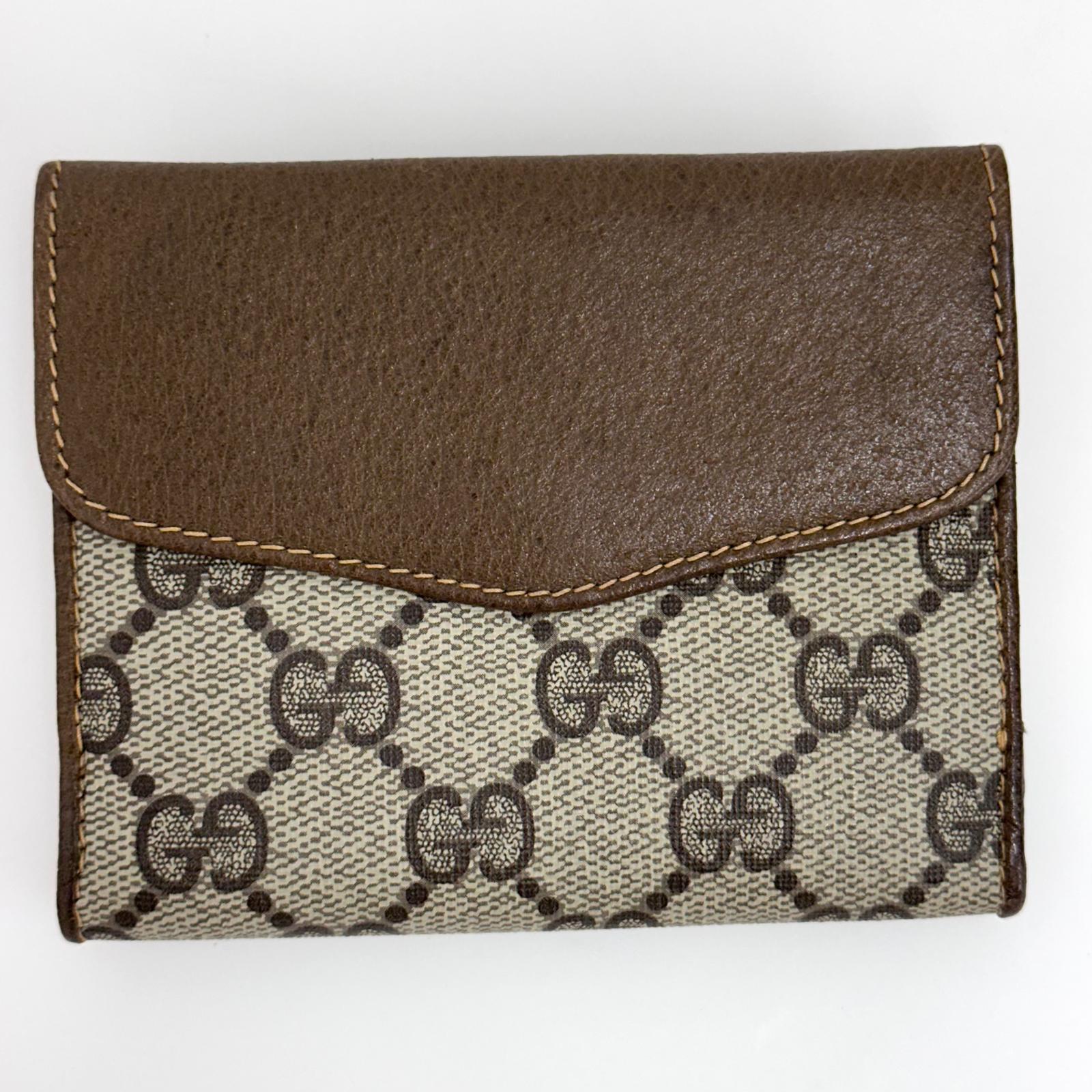 Gucci Portafoglio in tela GG Supreme e pelle marrone con chiusura Web