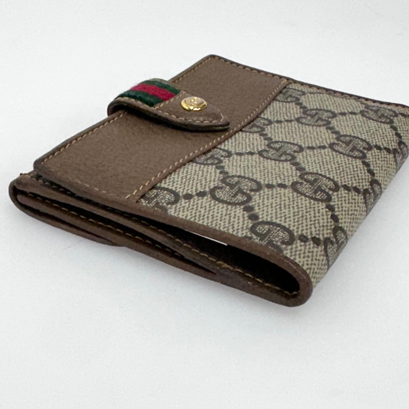 Gucci Portafoglio in tela GG Supreme e pelle marrone con chiusura Web