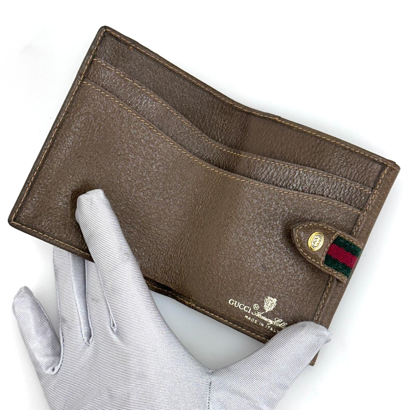 Gucci Portafoglio in tela GG Supreme e pelle marrone con chiusura Web