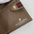Gucci Portafoglio in tela GG Supreme e pelle marrone con chiusura Web