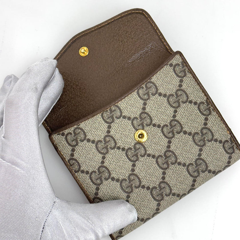 Gucci Portafoglio in tela GG Supreme e pelle marrone con chiusura Web