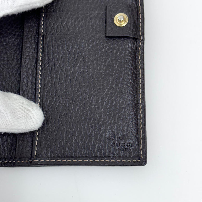 Gucci portafoglio donna Crystal in tela GG Supreme e pelle marrone