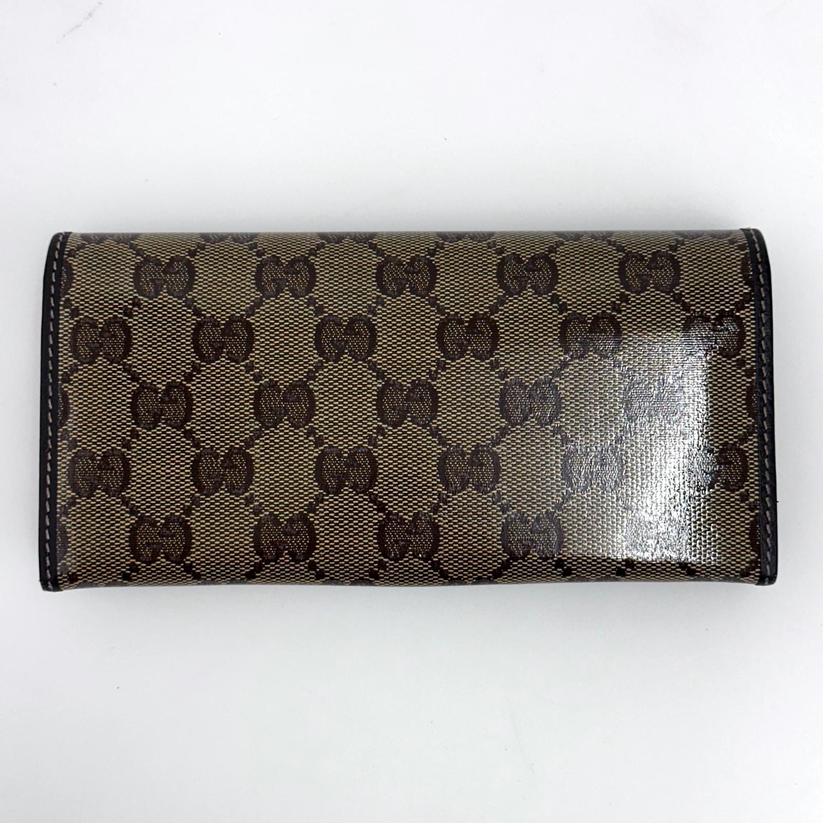 Gucci portafoglio donna Crystal in tela GG Supreme e pelle marrone