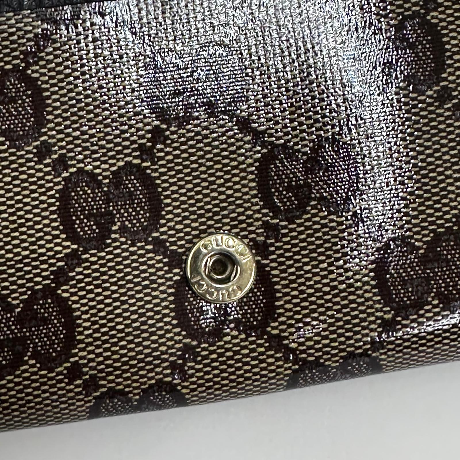 Gucci portafoglio donna Crystal in tela GG Supreme e pelle marrone