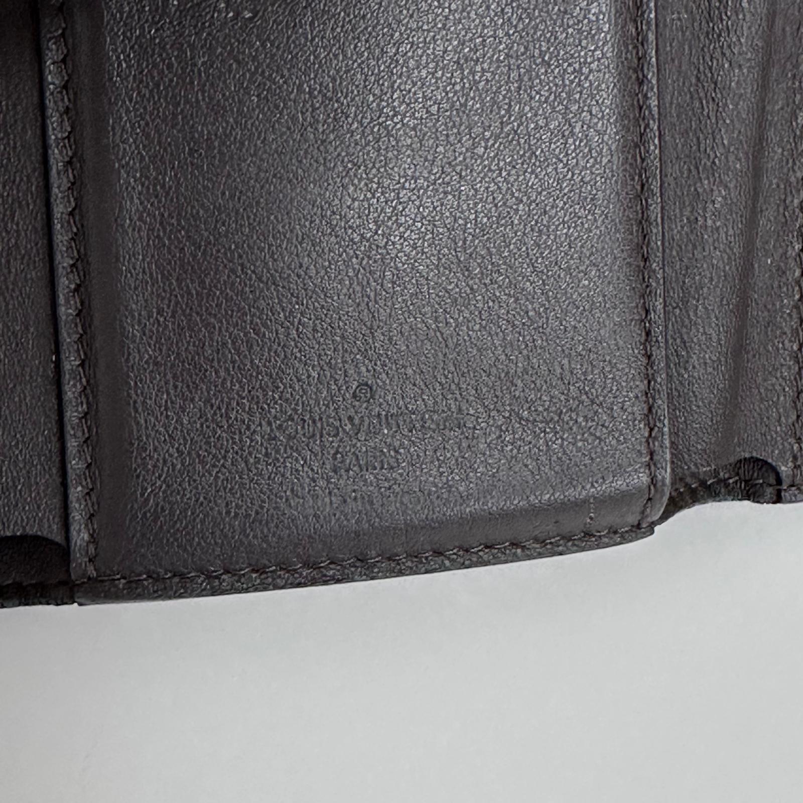 Louis Vuitton Portafoglio Capucines in pelle beige