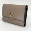 Louis Vuitton Portafoglio Capucines in pelle beige