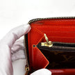 Louis Vuitton Portafoglio Zippé Clémence in Tela Monogram e arancio