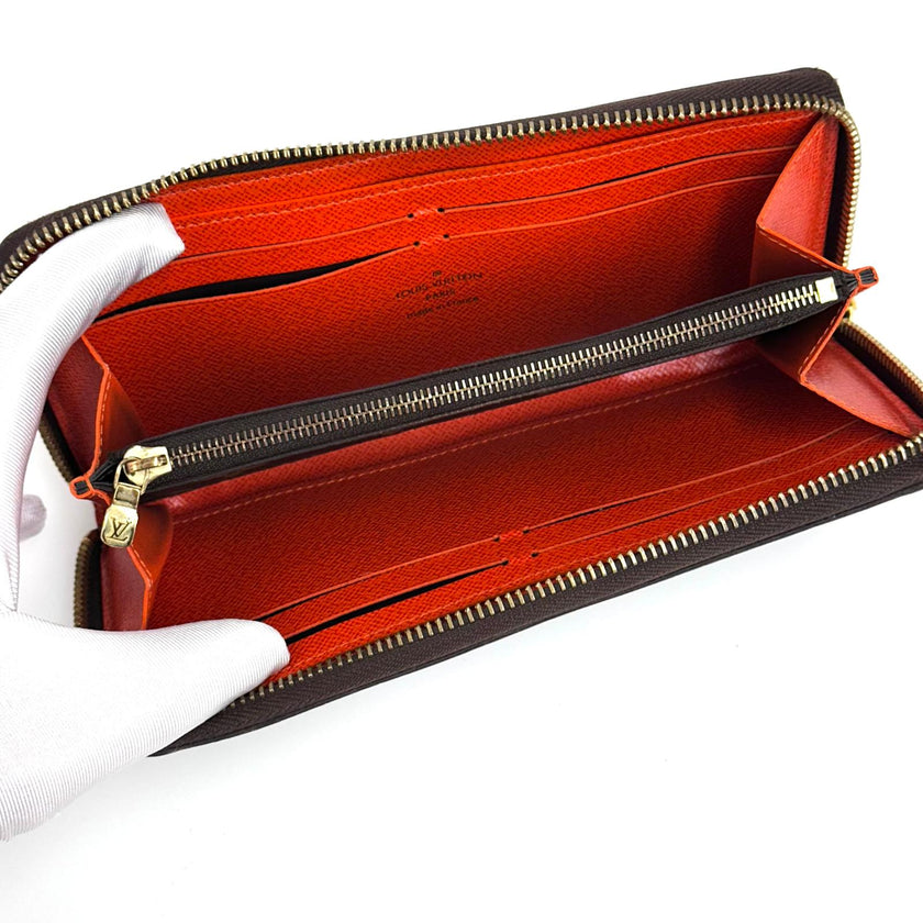 Louis Vuitton Portafoglio Zippé Clémence in Tela Monogram e arancio
