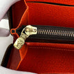 Louis Vuitton Portafoglio Zippé Clémence in Tela Monogram e arancio