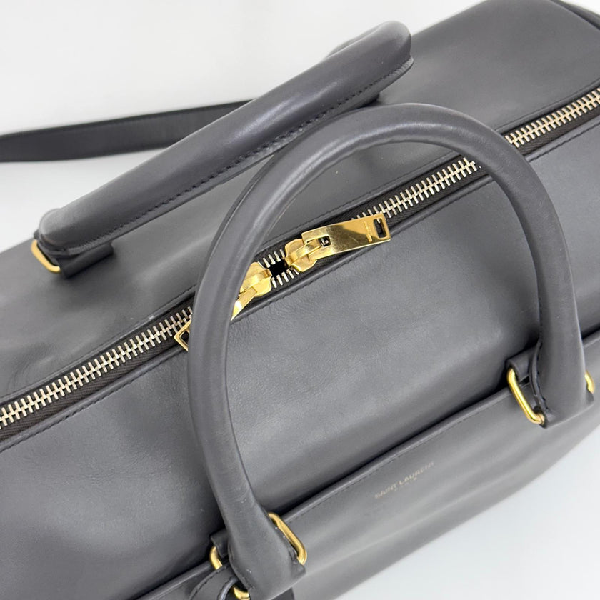 Saint Laurent Borsa modello Duffle in pelle grigia a due vie