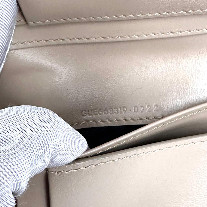 Saint Laurent Portafoglio compatto in pelle beige