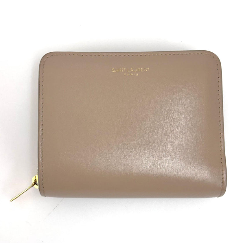Saint Laurent Portafoglio compatto in pelle beige