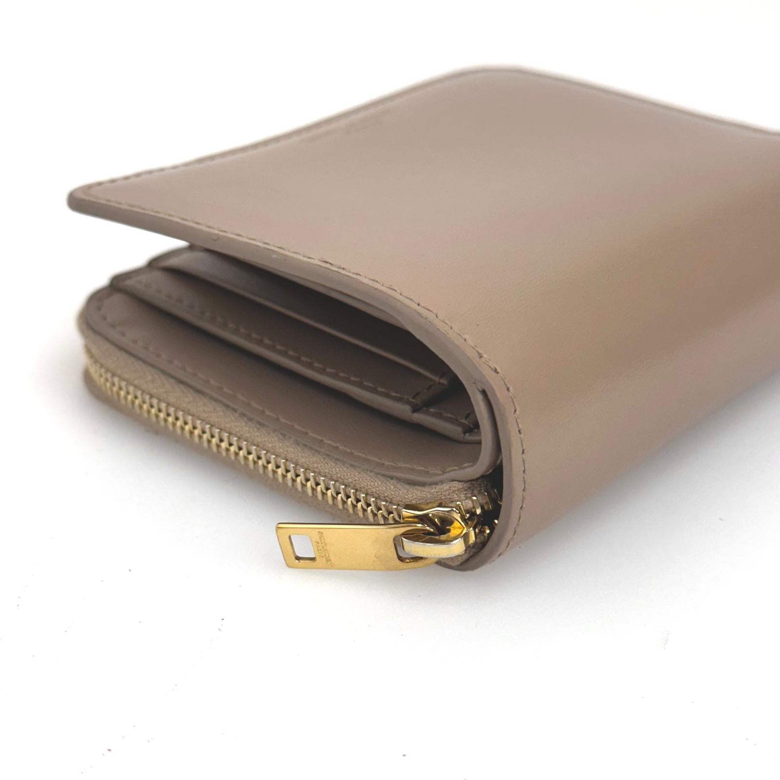 Saint Laurent Portafoglio compatto in pelle beige