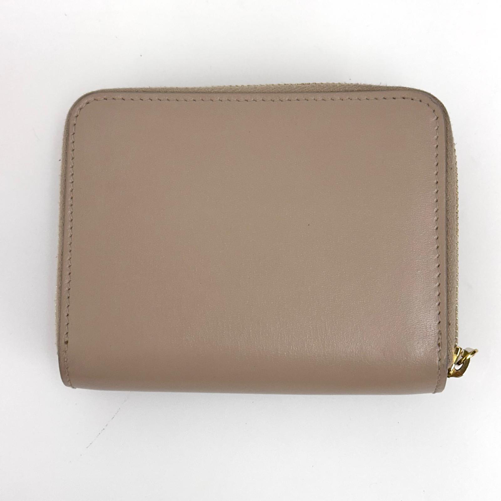 Saint Laurent Portafoglio compatto in pelle beige
