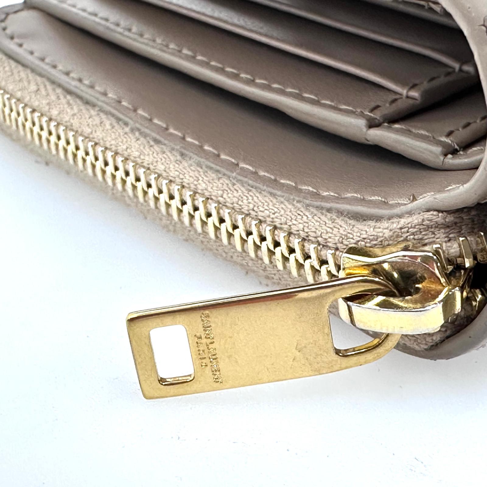 Saint Laurent Portafoglio compatto in pelle beige