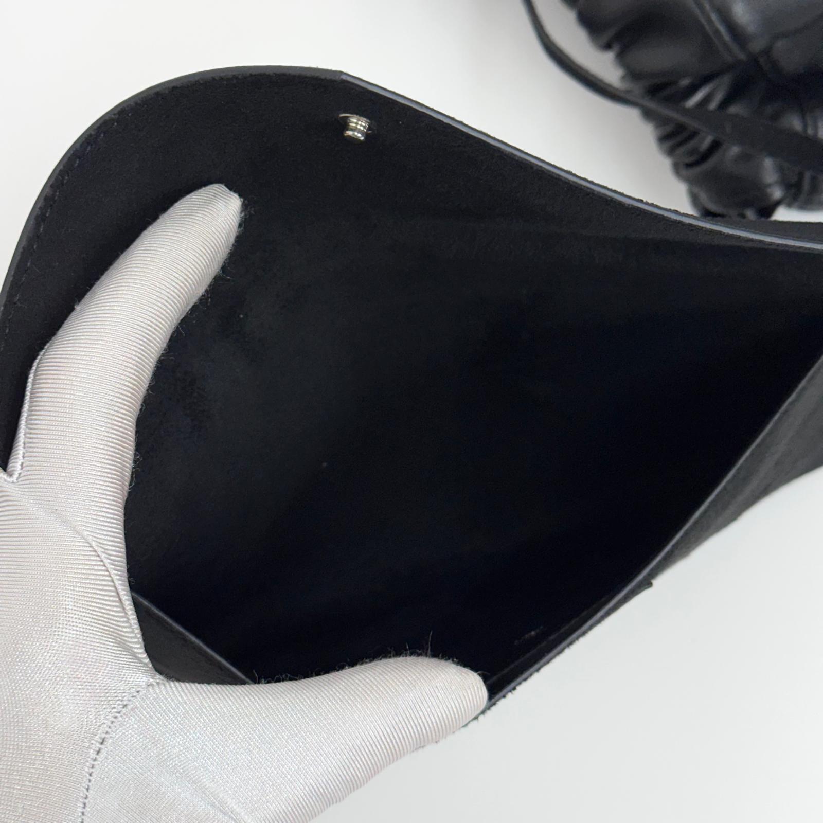 Saint Laurent borsa zaino unisex in pelle nera con pouch in camoscio