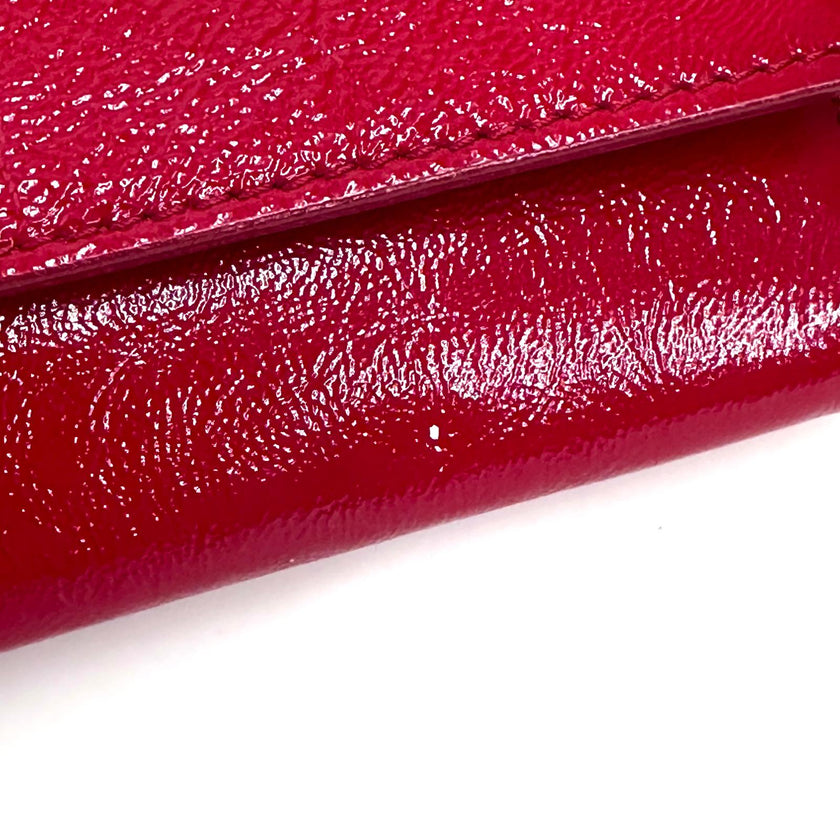 Saint Laurent pochette a mano Belle de Jour in vernice rossa